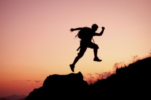 Man jumping on a rock.